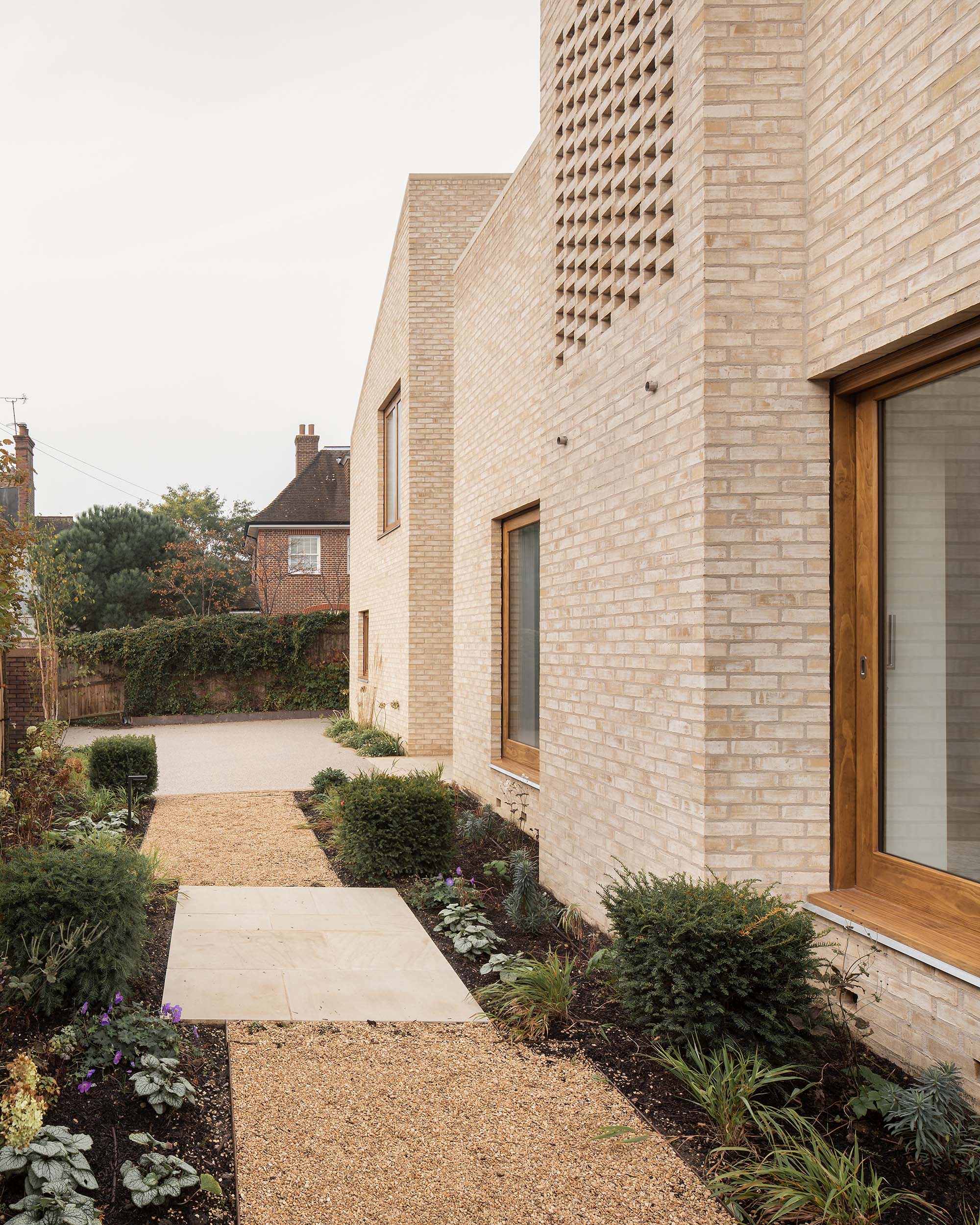 Erbar Mattes Architects Wimbledon custom new build contemporary modern timber frame brick house villa conservation area garden front